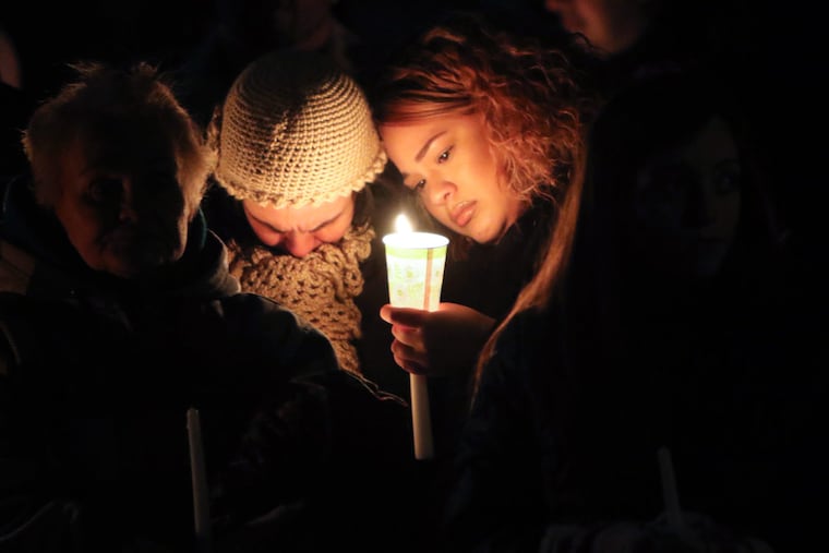 Friends and family gather for a vigil in memory of Roxanne Flores. Her husband has been charged in her death.