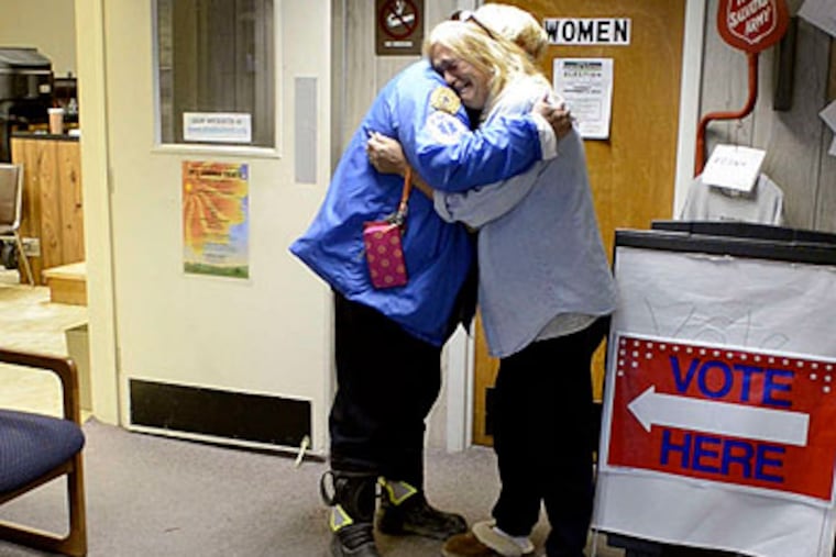 It's an emotional reunion for Beverly Tromm (right), deputy emergency management coordinator in Beach Haven, and Judi Hartney, a Surf City EMT, in Ship Bottom. (Tom Gralish / Staff Photographer)