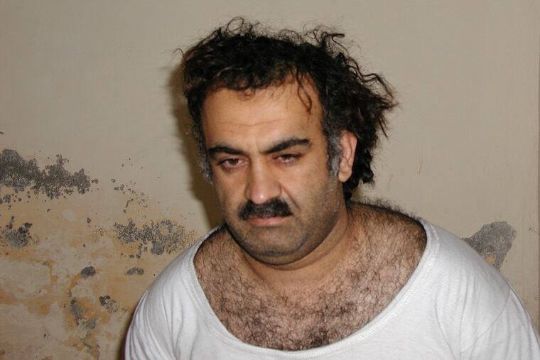 Khalid Sheikh Mohammed, the alleged Sept. 11 mastermind, is seen shortly after his capture during a raid in Pakistan Saturday March 1, 2003. The man accused of being the main plotter in al-Qaeda's Sept. 11, 2001 attacks has agreed to plead guilty, The Defense Department said Wednesday.