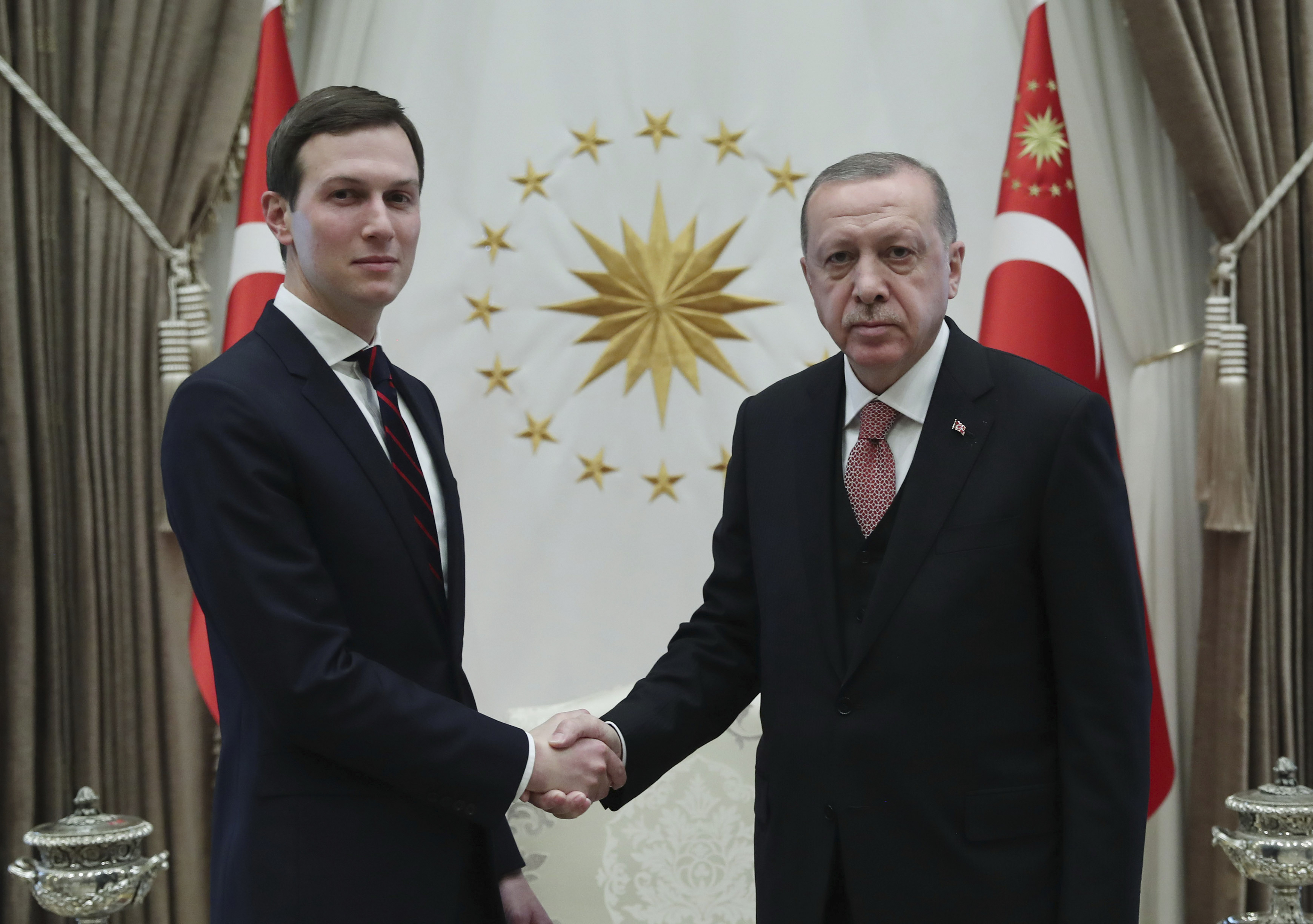 Turkey's President Recep Tayyip Erdogan, right, shakes hands with Jared Kushner, left, U.S. President Donald Trump's adviser, prior to their meeting at the Presidential Palace in Ankara, Turkey, Wednesday, Feb. 27, 2019. Erdogan met with with U.S. President Donald Trump's adviser and son-in-law for talks that are expected to centre on his planned Mideast peace initiative. Turkey's Economy Minister Berat Albayrak, who is Erdogan's son-in-law, was also present. (Presidential Press Service via AP, Pool)