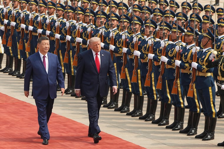 President Donald Trump participates in a welcome ceremony with China's President Xi Jinping at the Great Hall of the People, Thursday, May 14, 2026, in Beijing.