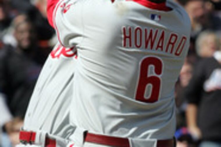 Phils teammates Abraham Nunez and Ryan Howard collide while trying to field a pop-up by the Mets' Jose Reyes. Charlie Manuel says his team is out of synch.