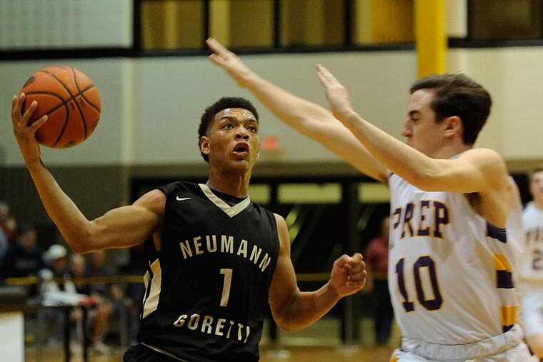 Neumann-Goretti's Quade Green (left) drives to the basket against
Scranton Prep's Pat Cosgrove.