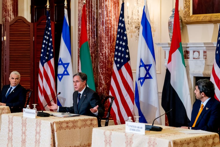 Secretary of State Antony Blinken accompanied by Israeli Foreign Minister Yair Lapid, left, and United Arab Emirates Foreign Minister Sheikh Abdullah bin Zayed al-Nahyanin, right, speaks at a joint news conference at the State Department in Washington, Wednesday, Oct. 13, 2021.
