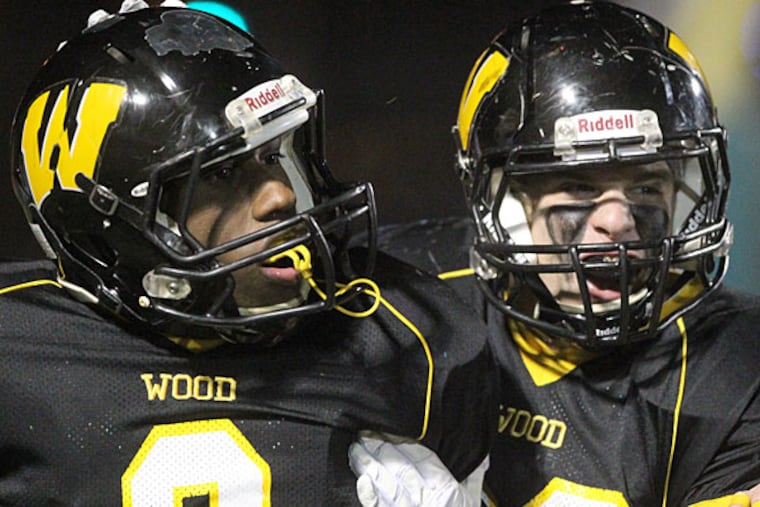 Chris Gary, left, of Archbishop Wood. (Charles Fox/Staff Photographer)