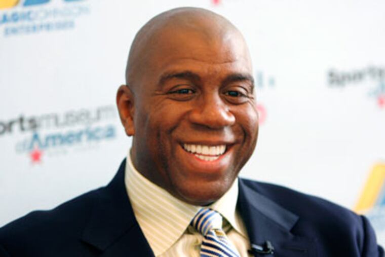 Magic Johnson led a group that purchased the Los Angeles Dodgers for $2 billion. (Seth Wenig/AP)
