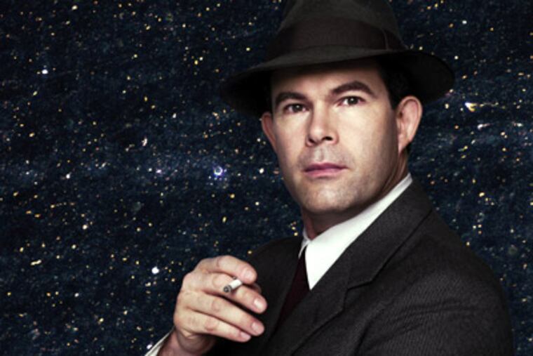 Gerald Finley stars as J. Robert Oppenheimer in John Adams's "Doctor Atomic." Background is Cornelia Parker's "Einstein's Abstracts." (Photo: Nick Heavican/Metropolitan Opera; background courtesy the artist)