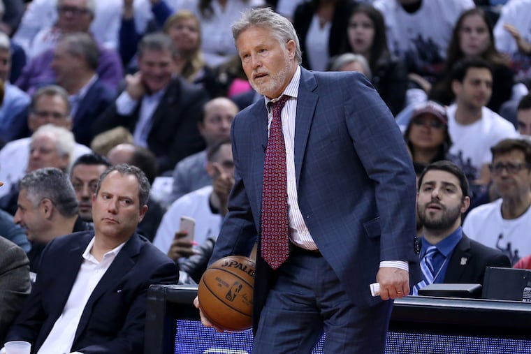 Coach Brett Brown of the Sixers grabs an errant ball on the sideline during Game 5.