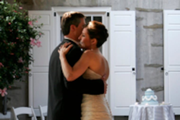 The newlyweds' first dance. The couple met through an online dating service.