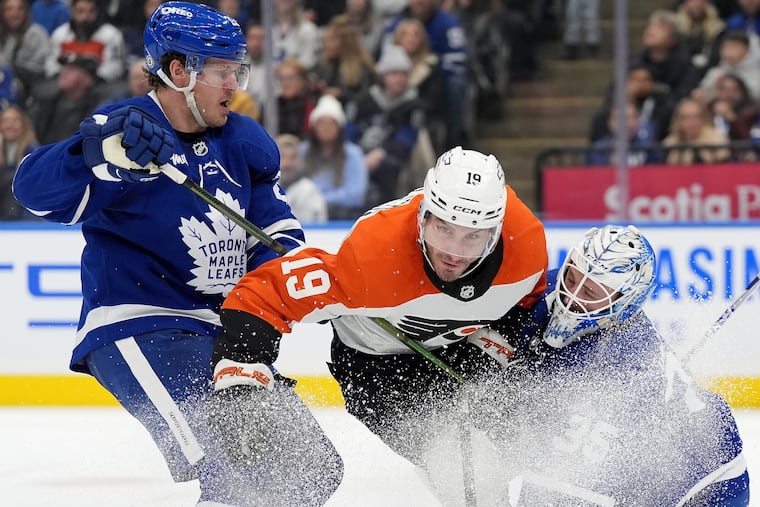 Philadelphia Flyers right wing Garnet Hathaway (19) is called for goaltender interference against Toronto Maple Leafs goalie Dennis Hildeby (35) during first-period NHL hockey game action in Toronto, Sunday, Jan. 5, 2025. (Frank Gunn/The Canadian Press via AP)