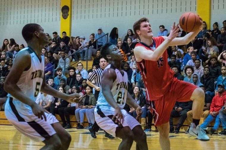 Neshaminy senior guard Chris Arcidiacono (15) drives to the basket against Harry S Truman.