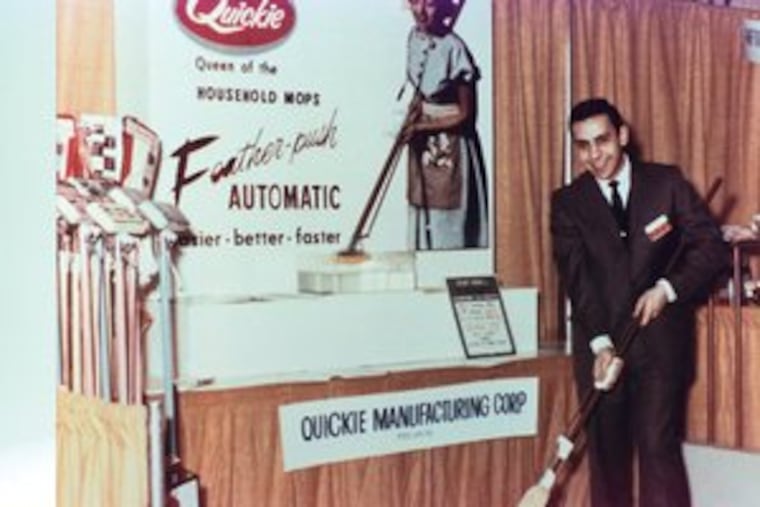 Peter Vosbikian demonstrates the mop invented by his father, Bedros Vosbikian, which put their company on the map.