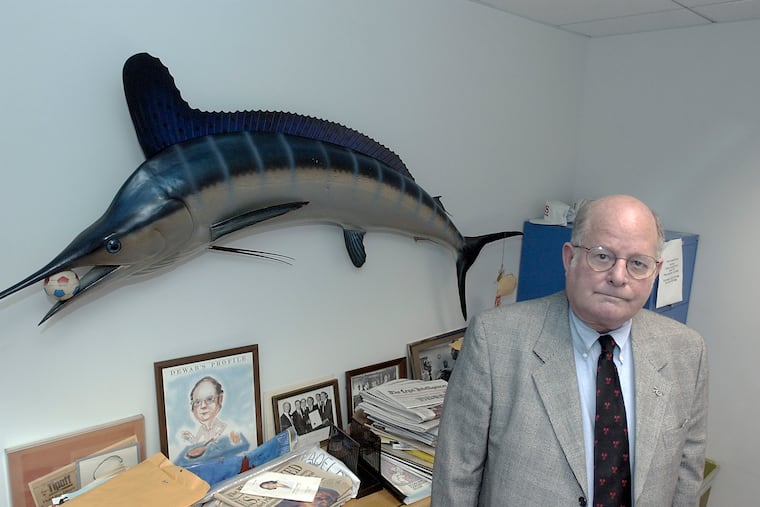 Fred Voigt poses with a prize catch in his office at the Committee of Seventy in this 2004 Inquirer file photo.