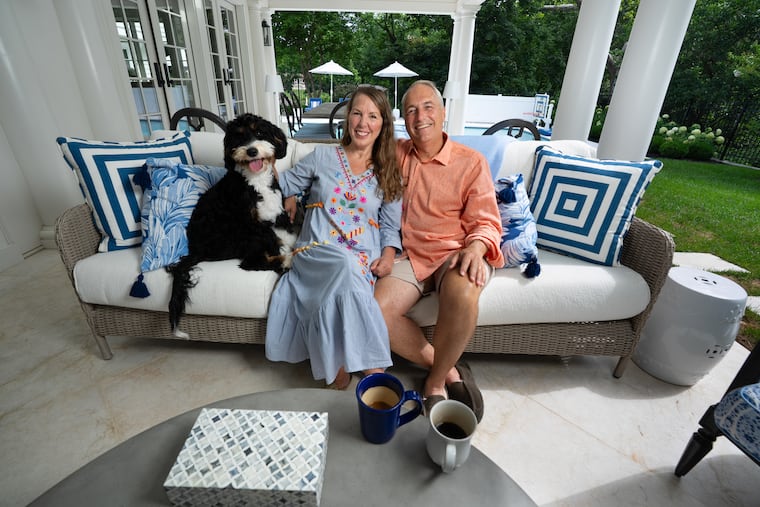 Kristen and David Knouft and their dog enjoy their outdoor seating area in Wayne, Pennsylvania.