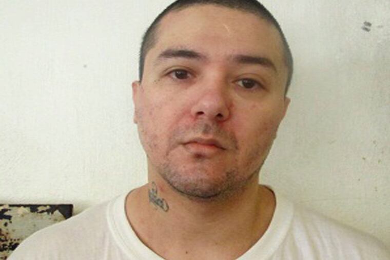 This undated photo provided by the Oklahoma Department of Corrections shows Raymond Pillado. Pillado a convicted killer, is a suspect in the death of his cellmate Anthony Palma. Prison officials say Palma was killed in his cell Friday, Jan. 11, 2019, at the Oklahoma State Penitentiary in McAlester, Okla. (Oklahoma Department of Corrections via AP)