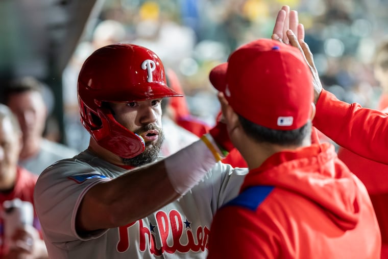 Kyle Schwarber celebrates after hitting a go-ahead two-run hit in the 11th inning to put the Phillies ahead for good.