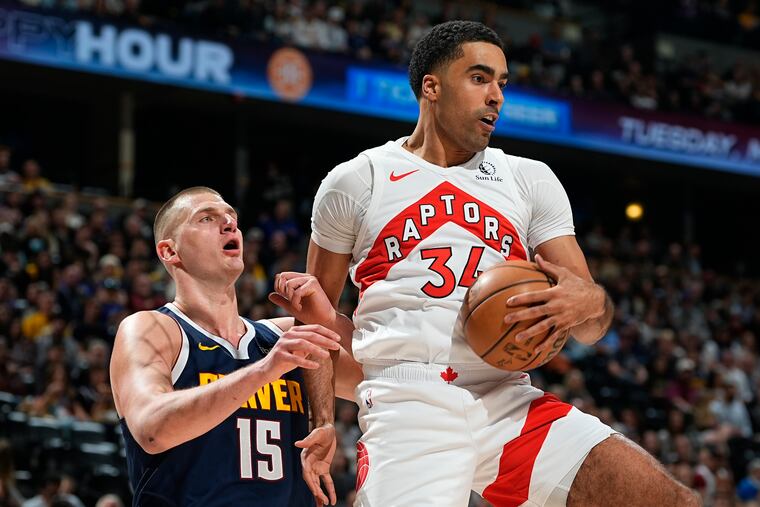 Raptors center Jontay Porter, right, shown during a March 11 game against the Nuggets.