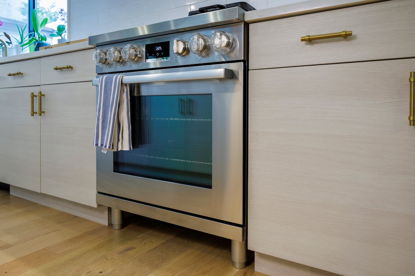 The small Bosch range, which has peg legs that allow Calhoun to sweep under it, has a high-powered center burner required for authentic Chinese stir-fries.