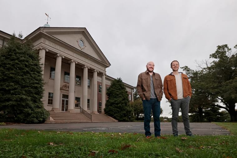 Velocity Venture founding partners Zach Moore (left) and Tony Grelli outside the former Harleysville Insurance Co., in Harleysville in October. That business, at the now unoccupied site, once employed 1,000-2,000 people.
