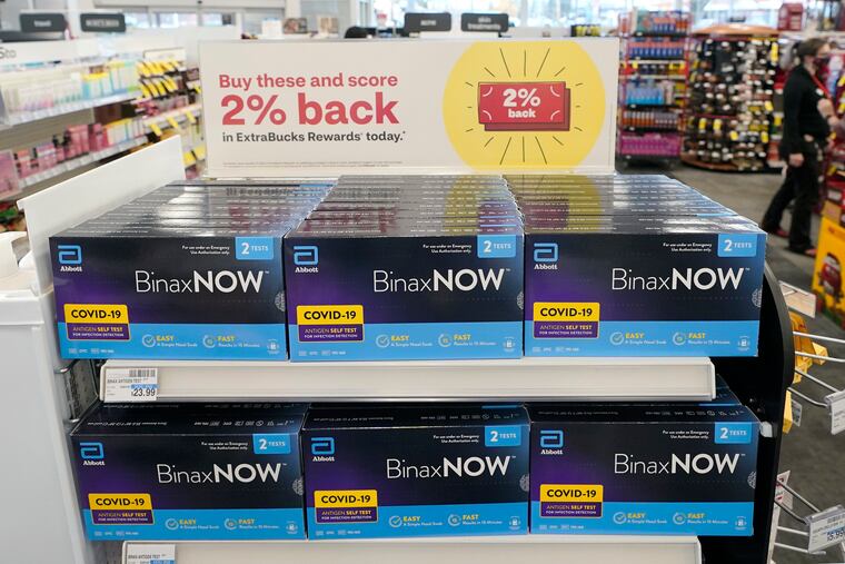 Boxes of BinaxNow home COVID-19 tests made by Abbott shown for sale Nov. 15 at a CVS store in Lakewood, Wash.