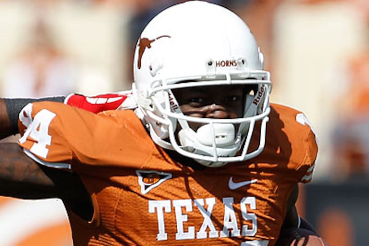 Marquise Goodwin plays football for Texas and is also on the 4x100- and 4x200-meter relay and long jump teams. (Eric Gay/AP)