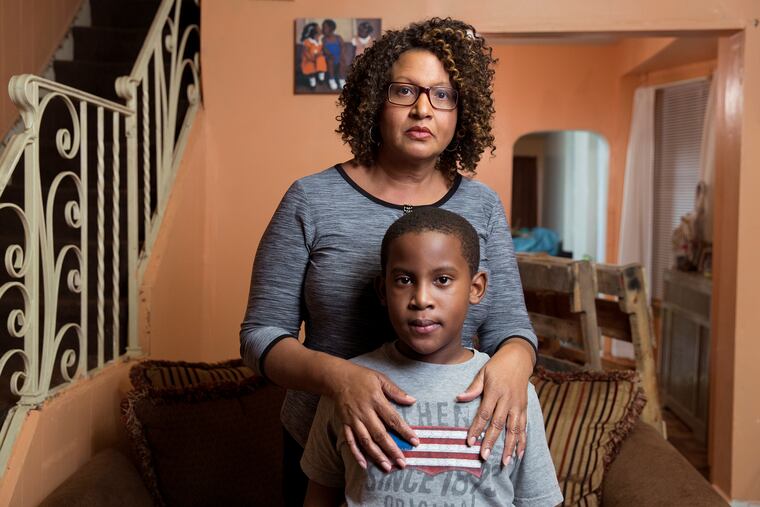 Avril Absolum and her son Jalen are shown here on October 5, 2016, at their home in Philadelphia. Jalen has developmental disabilities due to exposure to lead poisoning when he was two years old.