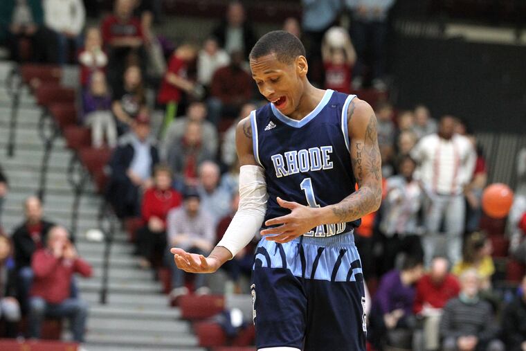 Fatts Russell holds out his shooting arm after hitting a three-pointer in ovetime and gesturing toward St. Joe's great Jameer Nelson.