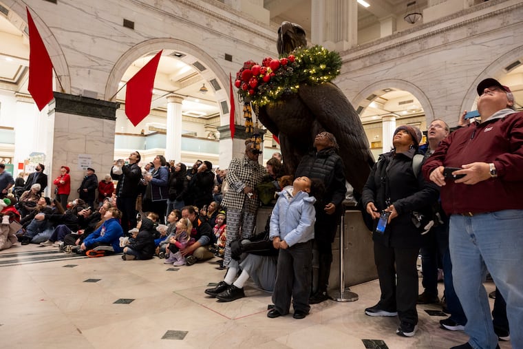 Darlene Harley, of Overbrook Park, and her great grandaughter, Aryline Nelson, 7, watch as the light show begins at the Wanamaker in Philadelphia, Pa., on Wednesday, Dec. 24, 2025.