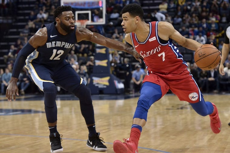 Sixers guard Timothe Luwawu-Cabarrot (7) drives against Memphis Grizzlies guard Tyreke Evans (12), for whom the Sixers are interested in trading.