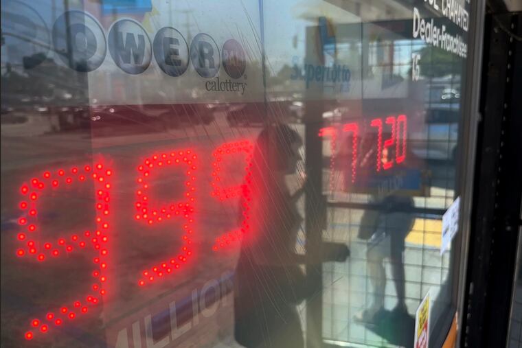 People buy Powerball tickets at Joe's Service Center, a Mobil gas station that previously sold the $2.04 billion-winning Powerball ticket at Woodbury Road and Fair Oaks Avenue in Altadena, Calif., on Wednesday.