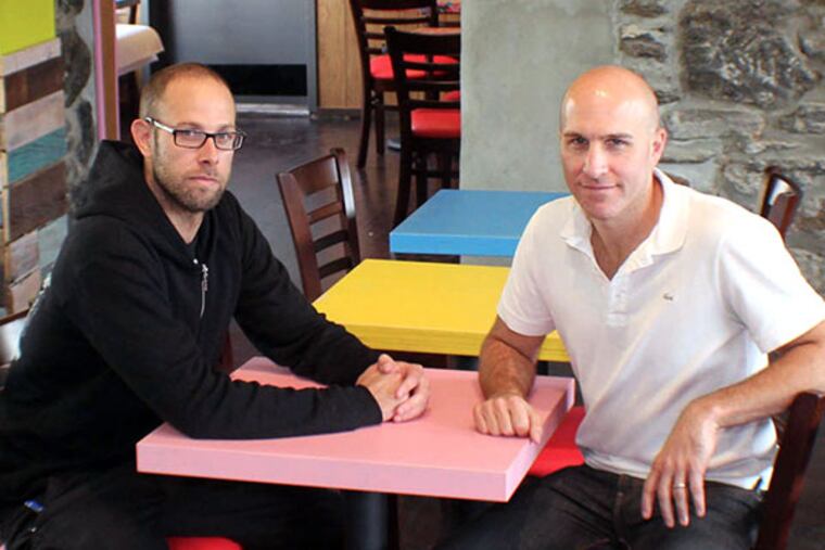 Chef Tim Spinner (left) and co-owner Brian Sirhal in the dining room at Taqueria Feliz in Manayunk. (MICHAEL KLEIN / Philly.com)