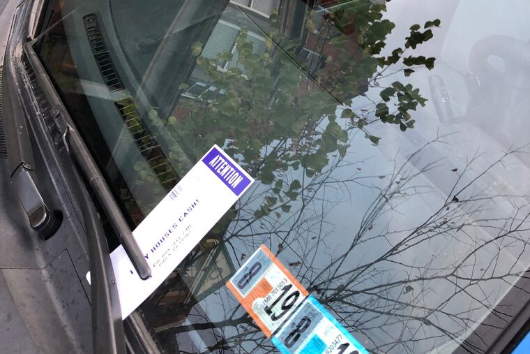 A flier left on a car along the 4800 block of Hazel Street in West Philadelphia on Tuesday, Aug. 20.