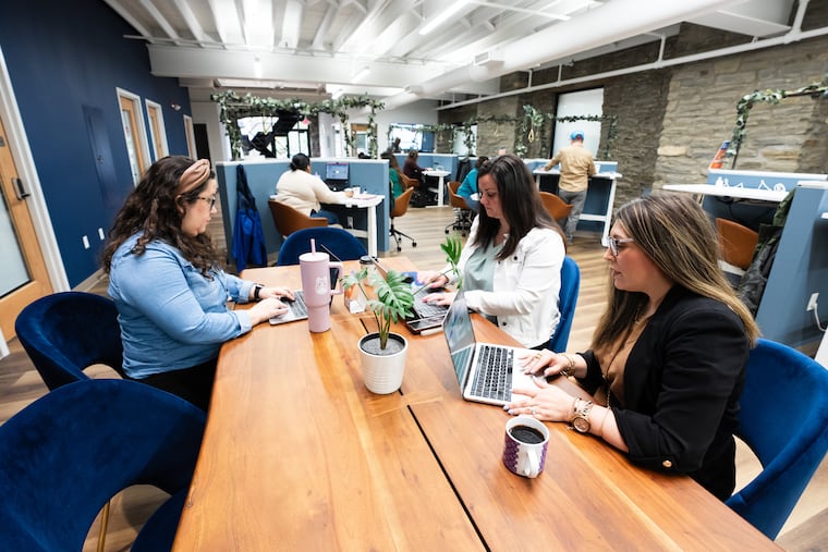 Locating your new business in a coworking space, shared with other entrepreneurs, can help with making connections, Gene Marks writes. (From left) Diana Miller, Heather Snyder, and Karen Mellor of iThrive Coworking gather at one of their company's coworking spaces in Wyncote in this file photo.
