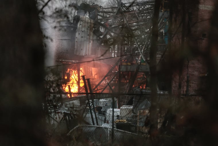 Flames from an explosion are seen in Logan Township, N.J. Wednesday, March 4, 2026.