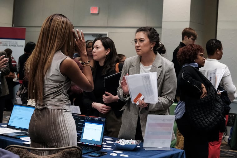 Former federal employees attend a job fair in Washington on March 14.
