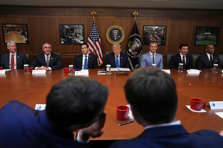 President Donald Trump (seated center) is joined by Energy Secretary Chris Wright, Interior Secretary Doug Burgum, Secretary of State Marco Rubio, Defense Secretary Pete Hegseth, acting Labor Secretary Keith Sonderling, and Housing and Urban Development Secretary Scott Turner at a cabinet meeting at Camp David, the presidential retreat, near Thurmont, Md., Friday, July 31, 2026.