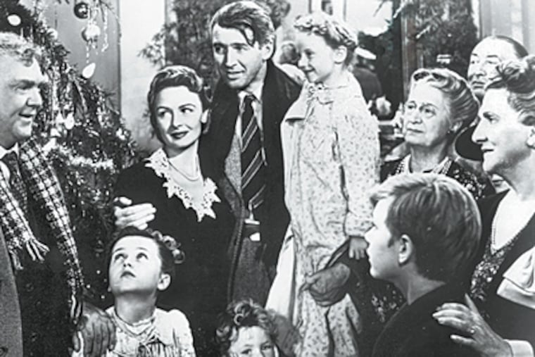 A frame from "It's a Wonderful Life." Karolyn Grimes, to the right of Jimmy Stewart, played the child who knows what happens every time a bell rings.