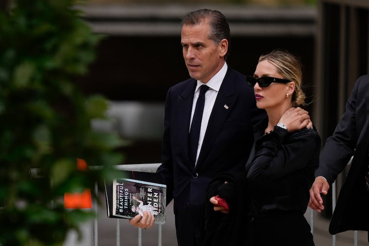 Hunter Biden, left, accompanied by his wife, Melissa Cohen Biden, depart from federal court on Wednesday, June 5, 2024, in Wilmington, Del.