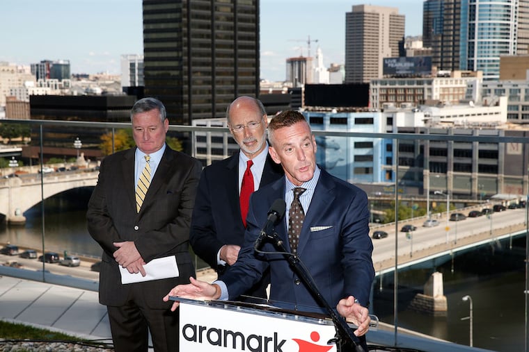 Philadelphia Mayor Kenney (left) and Pennsylvania Gov. Wolf,listen as Aramark Chairman Eric Foss announces Aramark’s decision to move to 2400 Market St. The announcement event was held on Cira Green.