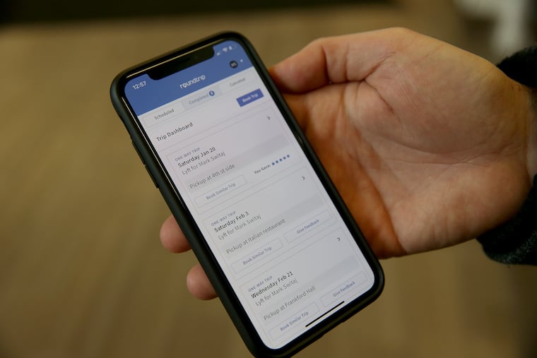 Mark Switaj, CEO of RoundTrip, displays the mobile version of his company's app.