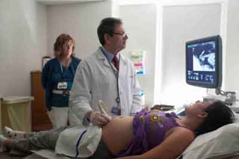 Obstetrician Jack Ludmir founded a prenatal clinic for immigrants. He does not ask their status, but estimates that at least 14 percent of the women who deliver there are here illegally. (Ed Hille / Staff Photographer)