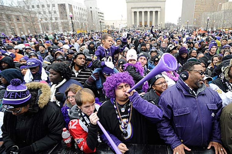 The 75,000 fans who had waited patiently and noisily for hours to greet Joe Flacco and the new NFL champions screamed madly at the sight of the lanky quarterback. (Gail Burton/AP)