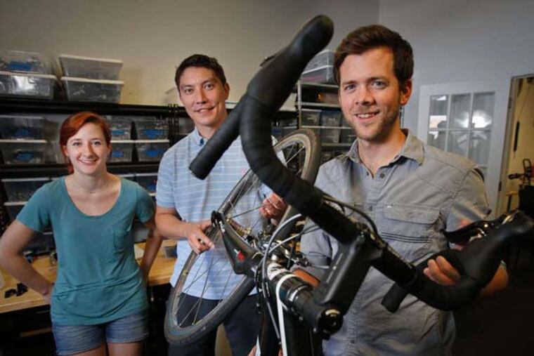 Diana Balderson, assembly tech, and Redshift Sports cofounders Stephen Ahnert and Scott Poff. Redshift Sports is designing a suspension stem to help smooth out road surfaces. ( ALEJANDRO A. ALVAREZ / Staff Photographer )