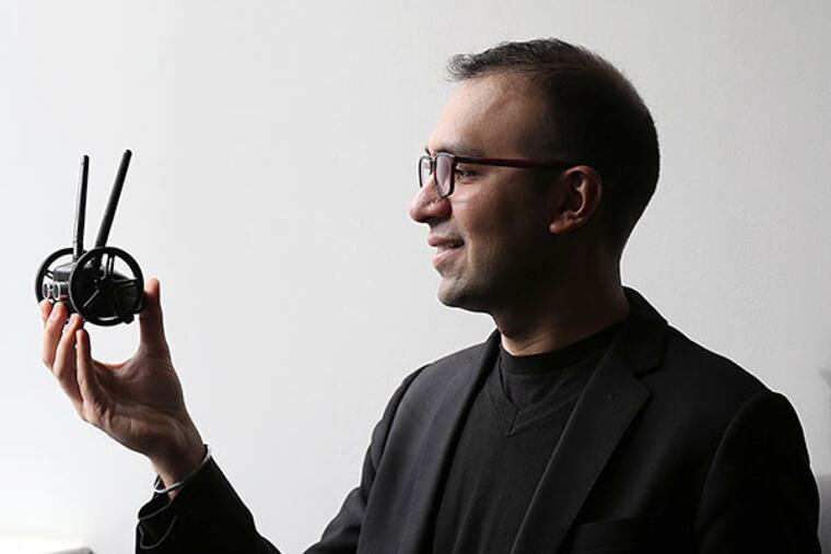 Pramod Abichandani hopes his robot will help students become knowledgeable about STEM. DAVID MAIALETTI / STAFF PHOTOGRAPHER