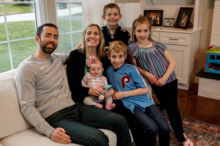 Kevin and Julie McMonagle at their Lafayette Hill home with children Marty, 8, in the back; Maggie, 7, at right; Jack, 10, center; and Colleen, now 5 months, in Julie's lap.