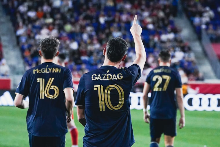 Dániel Gazdag (center) gives a shoutout to the traveling Union fans after scoring his penalty kick goal during the first half.