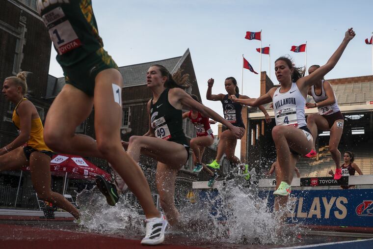 The college women’s 3,000-meter steeplechase championship takes place in the evening on the first day of the 2023 Penn Relays at Franklin Field.