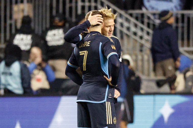The Union’s Mikael Uhre (left) is consoled by teammate Jakob Glesnes after losing to New York City FC during conference semifinal of the MLS playoffs at Subaru Park on Sunday.