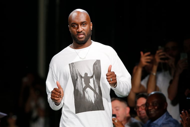 FILE -Fashion designer Virgil Abloh gives a thumbs up after the presentation of Off-White Men's Spring-Summer 2019 collection presented in Paris, Wednesday June 20, 2018. Abloh, a leading fashion executive hailed as the Karl Lagerfeld of his generation, has died after a private battle with cancer. He was 41. Abloh’s death was announced Sunday, Nov. 28, 2021 by LVMH Louis Vuitton and the Off White label, the brand he founded. (AP Photo/Thibault Camus, File)