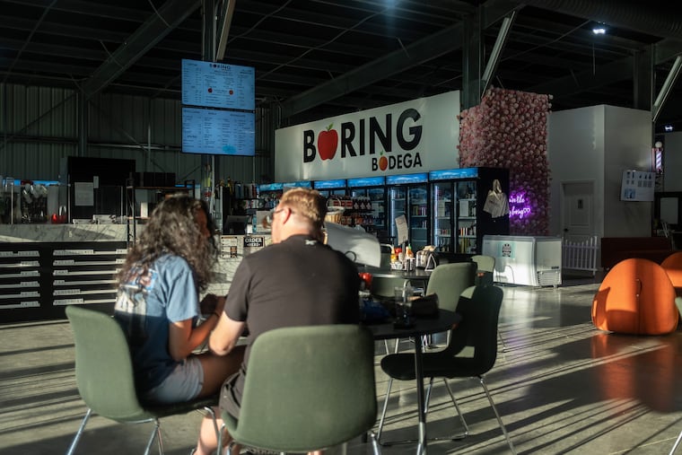 The Boring Bodega, a gathering spot with a convenience store and bar across from the SpaceX building in Bastrop, Texas, June 12, 2026. Elon Musk built a huge complex outside the city of Bastrop, population 14,000 — its residents now wonder what the historic SpaceX initial public offering might mean for them.